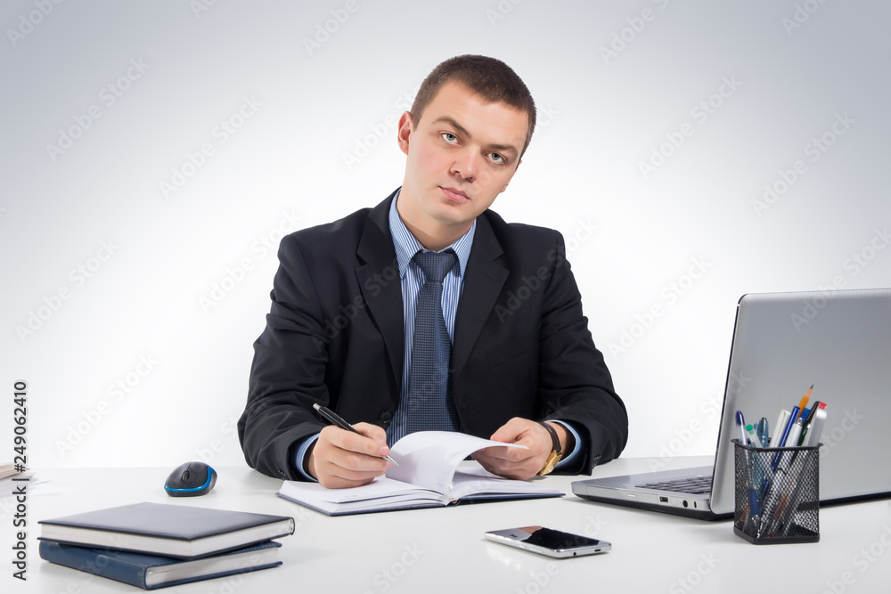 Business man working with documents and laptop Business man working with documents and laptop