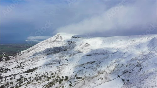 Drone footage of fresh snowfall on N. Ireland mountain located on the Sperrins. photo