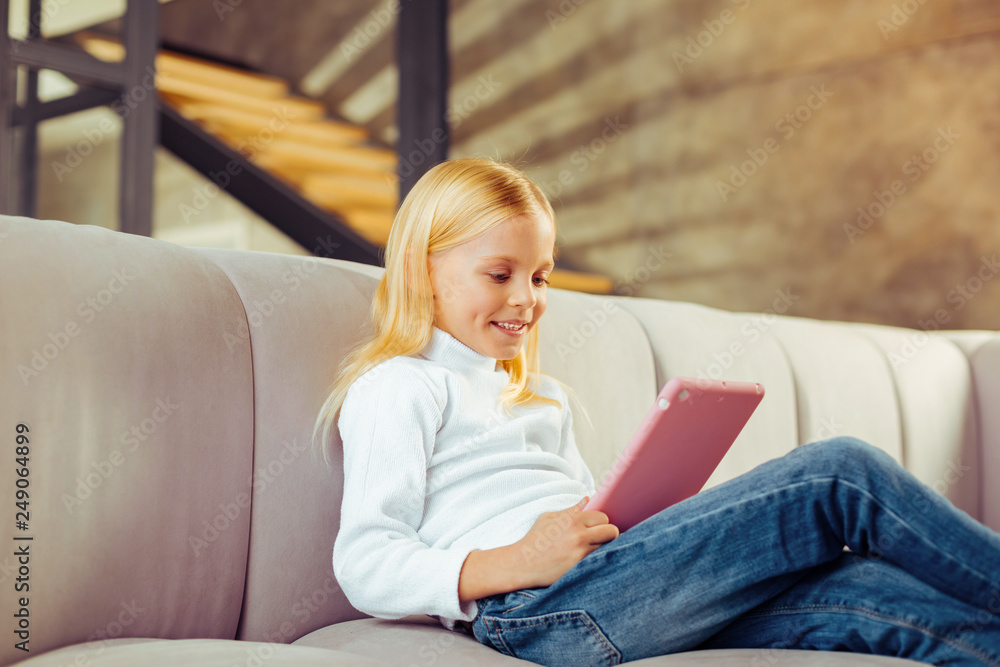 Charming blonde kid spending her day at home Charming blonde kid spending her day at home