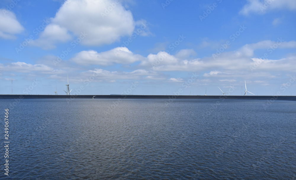 Alternative Energy Concept, Wind Turbines on Divided Sky and Dam image