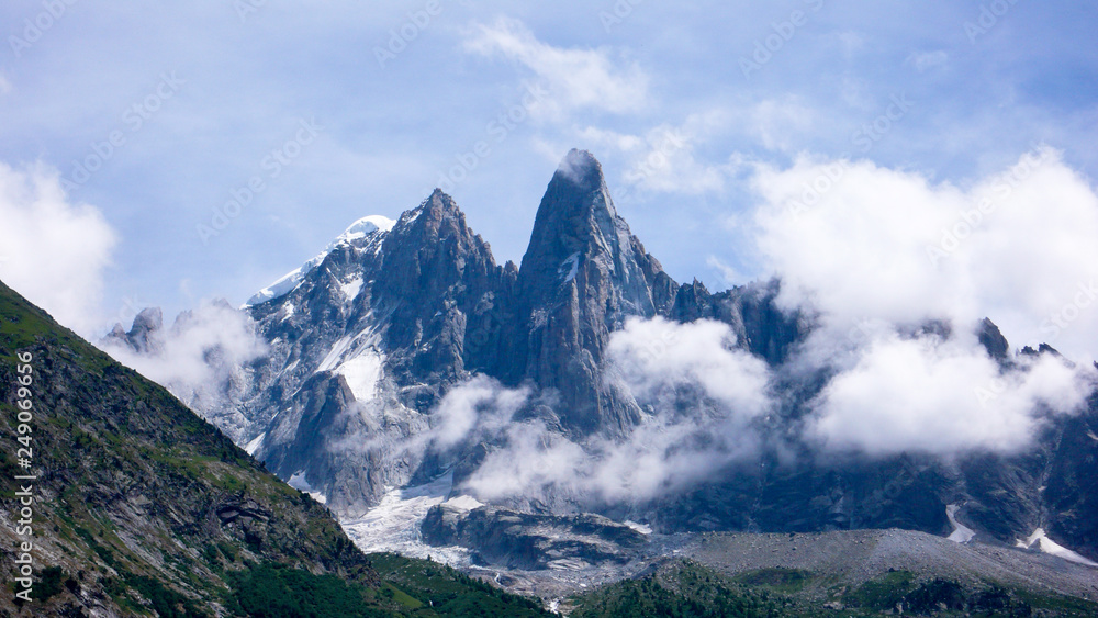 jagged mountain peak landscape with clouds