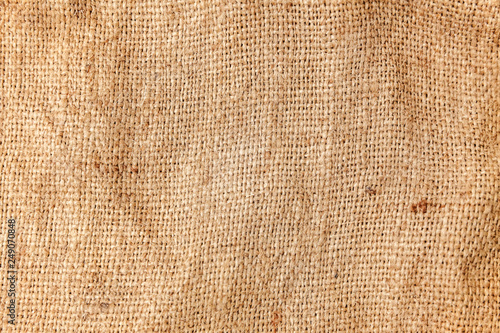 Pastel abstract Hessian or sackcloth burlap woven fabric texture. Wallpaper of artistic wale linen canvas. Blanket or Curtain of cotton pattern background in yellow beige cream sepia brown color