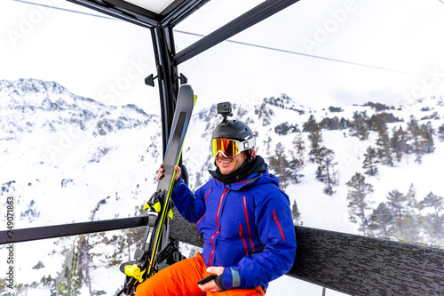 Skier traveling on the cable car