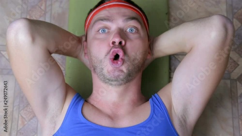 Funny sportsman  doing press-up exercises. man doing crunches