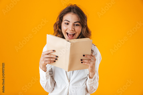 Portrait of a cheerful young woman wearing white shirt