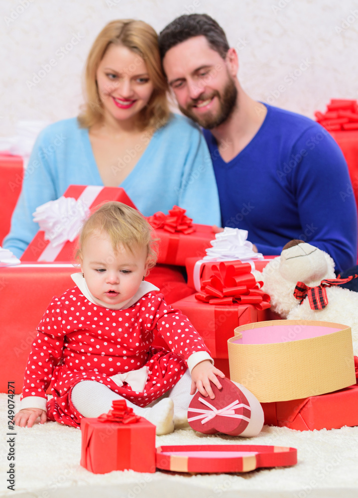 Enjoying happy moments. Valentines day. Red boxes. Shopping online. Love and trust in family. Bearded man and woman with little girl. father, mother and doughter child. Happy family with present box Enjoying happy moments. Valentines day. Red boxes. Shopping online. Love and trust in family. Bearded man and woman with little girl. father, mother and doughter child. Happy family with present box