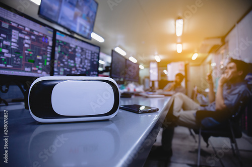 VR Box / Virtual Reality glasses  in the production control room.Control room of a steam Turbine,Generators of the coal-fired power plant for monitor process, business and industry concept