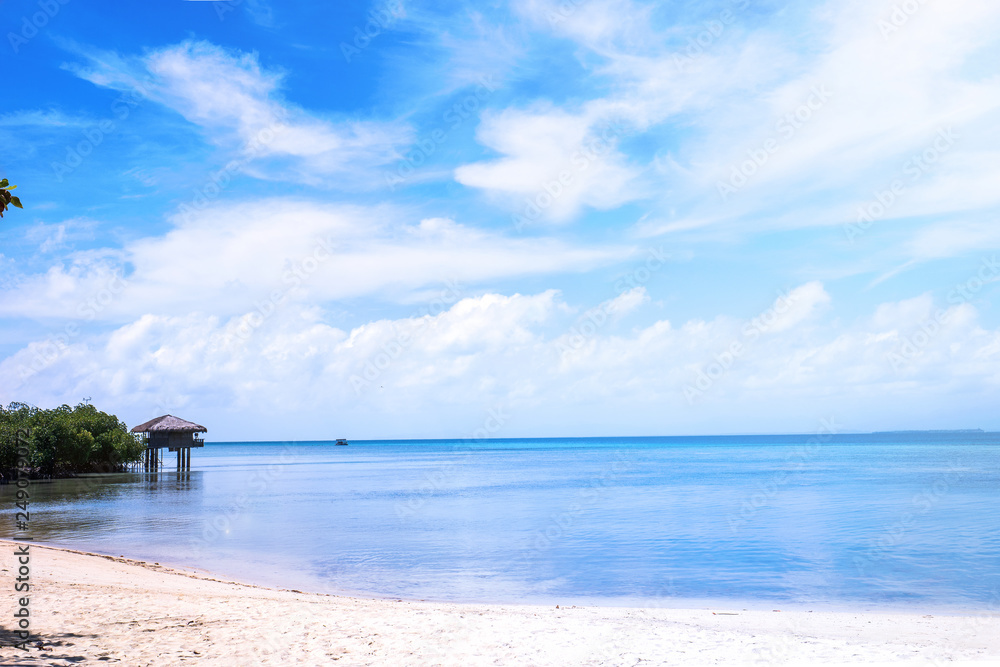 Chairs on the amazing beautiful sandy beach near the ocean with blue sky. Concept of summer leisure calm vacation for a tourism idea. Empty copy space, inspiration of tropical landscape Chairs on the amazing beautiful sandy beach near the ocean with blue sky. Concept of summer leisure calm vacation for a tourism idea. Empty copy space, inspiration of tropical landscape