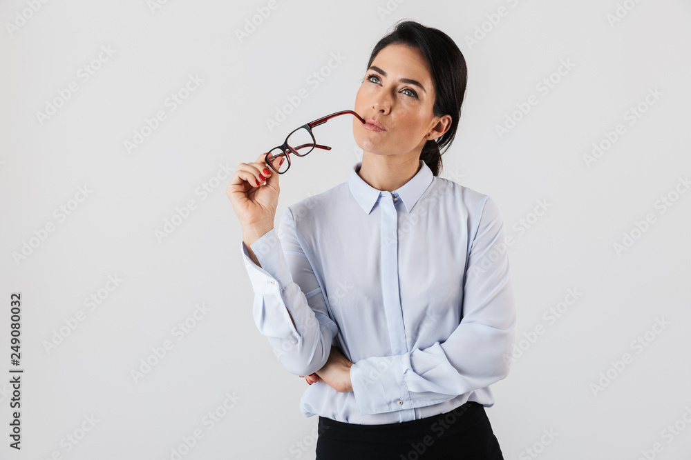 Image of beautiful secretary woman wearing eyeglasses standing in the office, isolated over white background Image of beautiful secretary woman wearing eyeglasses standing in the office, isolated over white background