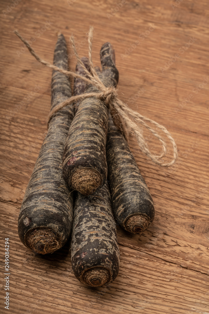 red carrots on wooden table with copy space red carrots on wooden table with copy space