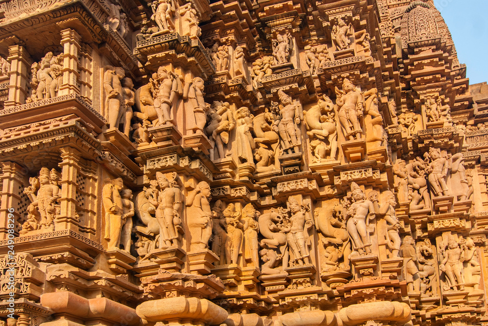 Relief sculptures of erotic scenes, on the facade of the Khajuraho temple, India.