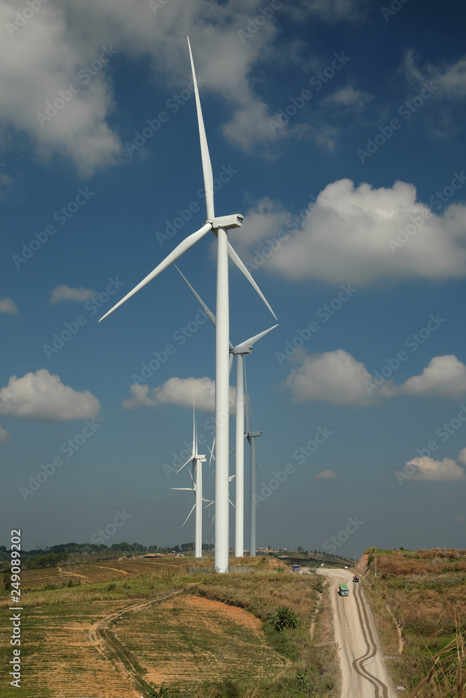 Windmill farm with blue sky and clouds Windmill farm with blue sky and clouds