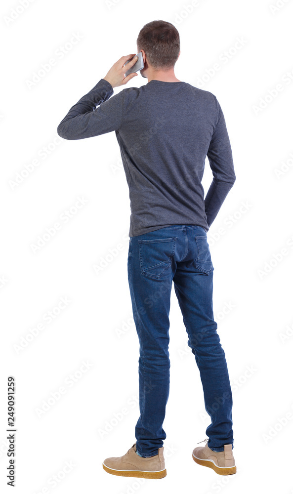 back view of a man talking on the phone back view of a man talking on the phone