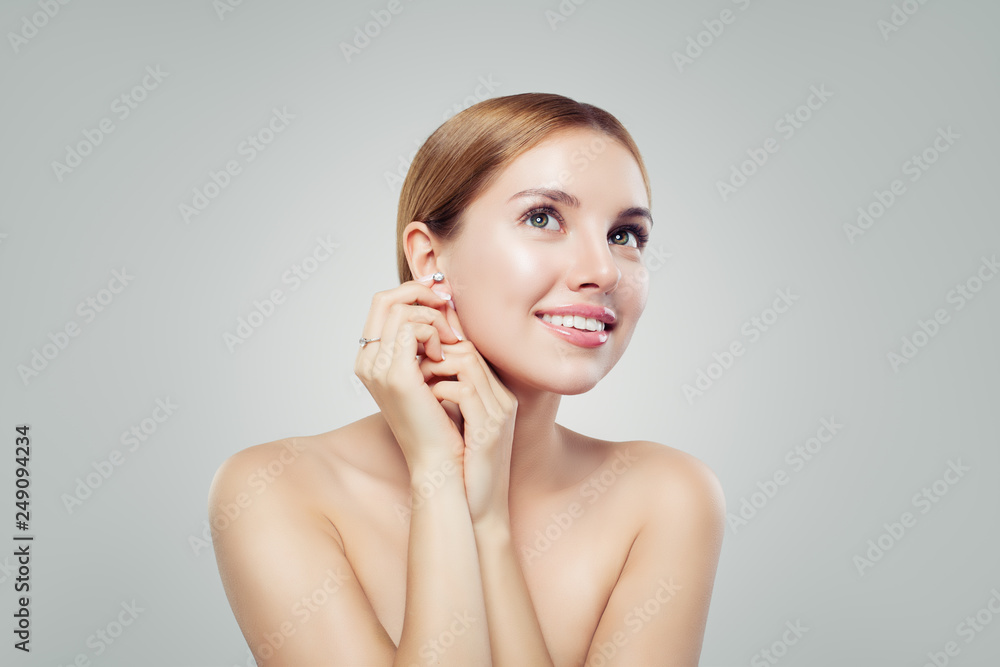 Perfect young woman with diamond earrings and ring, luxury jewelry model Perfect young woman with diamond earrings and ring, luxury jewelry model
