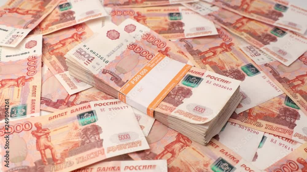 Stack of banknotes and keys, many banknotes of five thousand Russian rubles as a background, packed stack of banknotes 5000 rubles, five hundred thousand Stack of banknotes and keys, many banknotes of five thousand Russian rubles as a background, packed stack of banknotes 5000 rubles, five hundred thousand