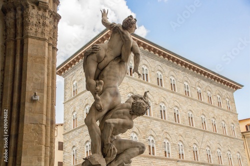 Sculpture The Rape of the Sabine Women, made by sculptor Giambologna (1574–82). Loggia dei Lanzi on the Piazza della Signoria in Florence, Italy. photo