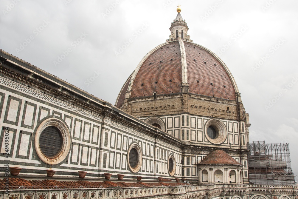 Florence Duomo. Basilica di Santa Maria del Fiore (Basilica of Saint Mary of the Flower). Florence Cathedral from Giotto's bell tower. Cloudy, dramatic and rainy sky. Florence, Italy.