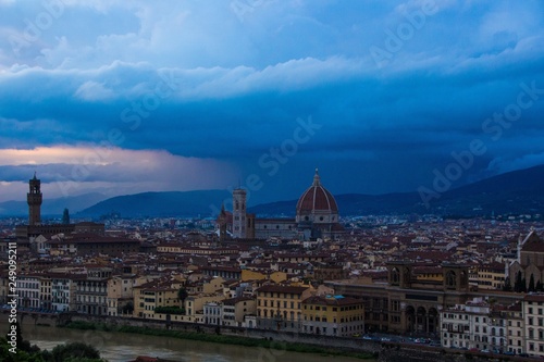 Cathedral of Santa Maria del Fiore (Duomo) and Arnolfo tower of Palazzo Vecchio. Night view from night from Piazzale Michelangelo. Sunset in beautiful Florence, Italy.