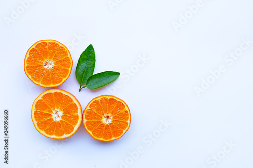 Fototapeta Naklejka Na Ścianę i Meble -  High vitamin C. Fresh orange citrus fruit with leaves isolated on white