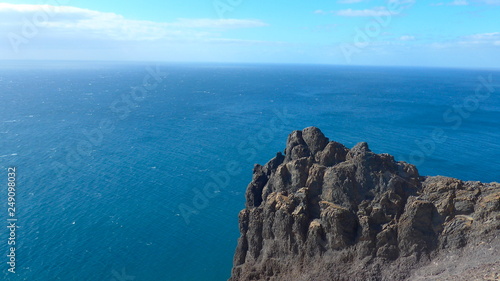 Black lava rock in front of blue sea on the island of Lanzarote 