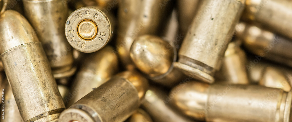 Top close-up macro view of large group of gun bullets Top close-up macro view of large group of gun bullets