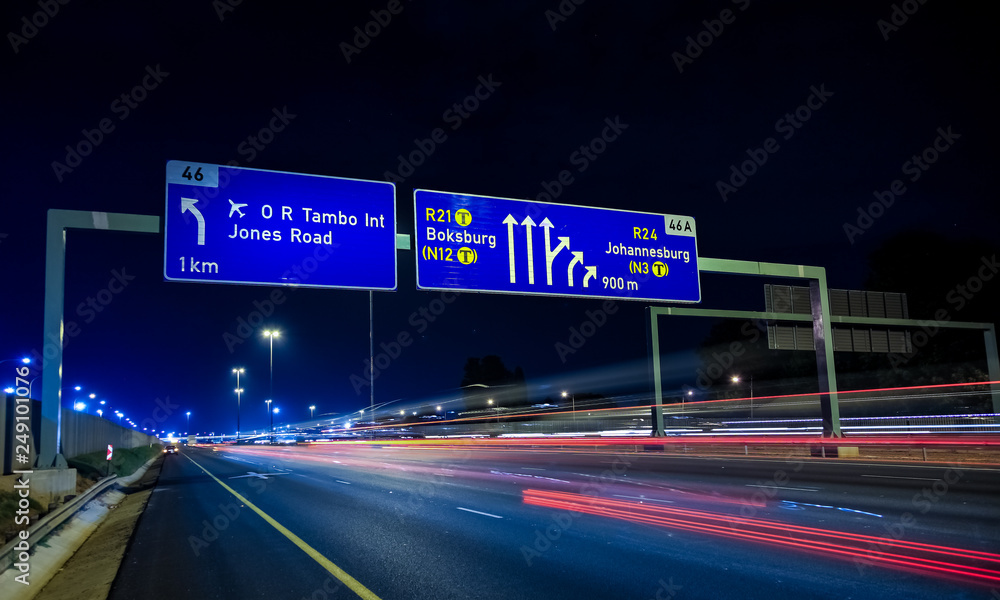 Fototapeta premium Motorway Signs on Highway at night
