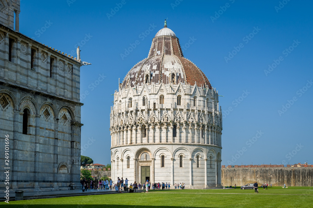 Pisa Baptistery and central square with green field. Pisa, Toscana province, Italy.