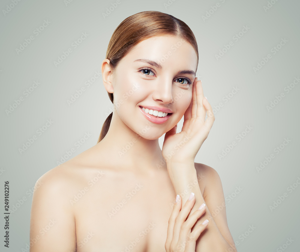 Young female face with healthy skin. Facial treatment, skincare and cosmetology concept. Young female face with healthy skin. Facial treatment, skincare and cosmetology concept.