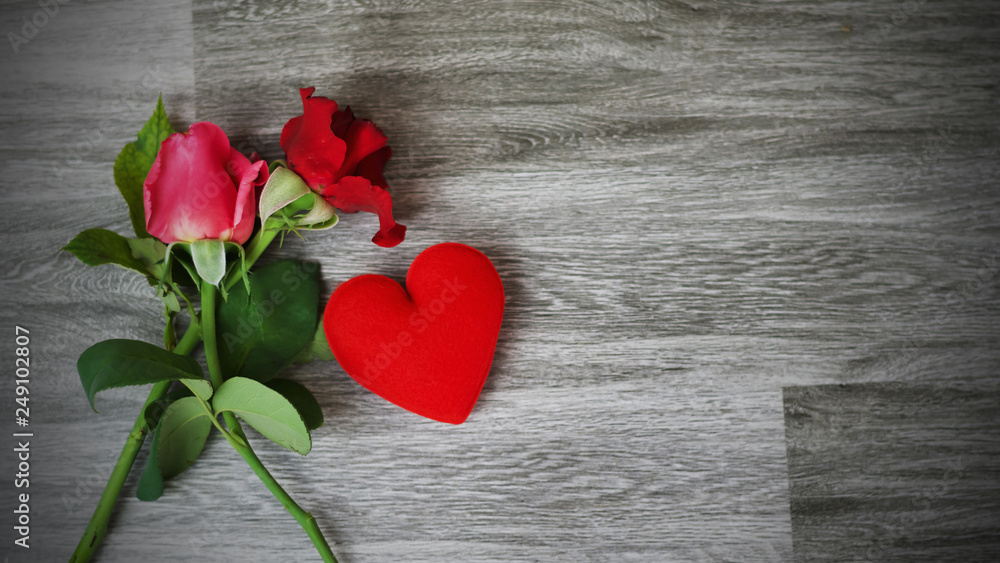 rose flower and heart on table background. concept valentine day