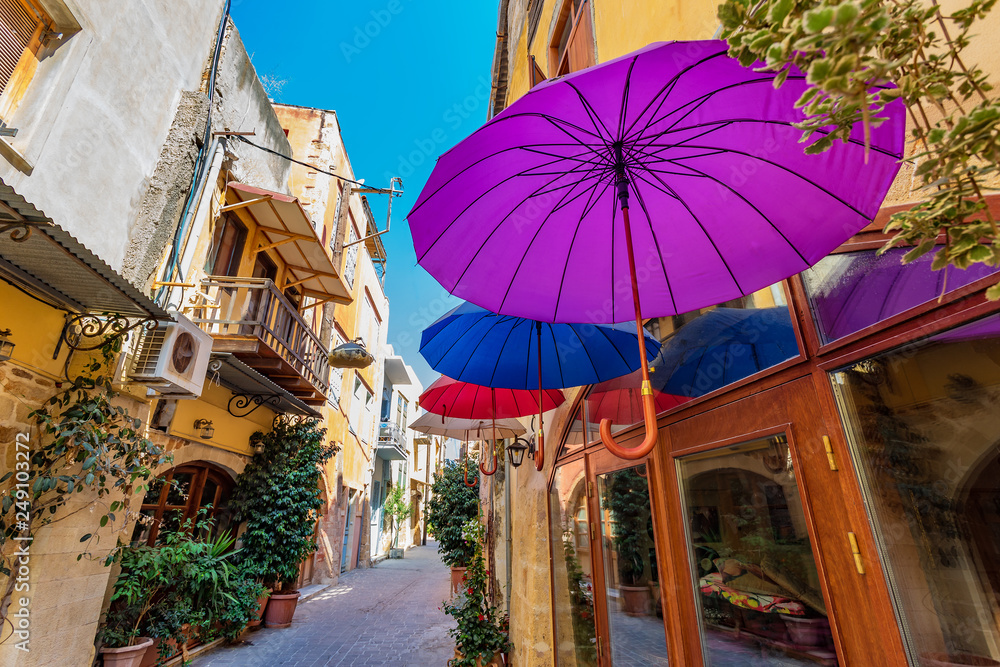 Obraz premium Colorfull Umbrellas hanging over the street in Chania, Greece
