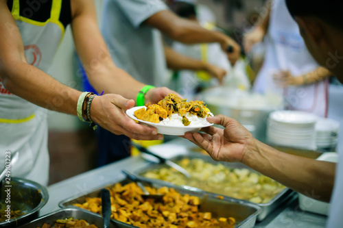 Volunteers have been feeding the homeless, They reach out with love and concern. photo