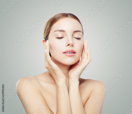 Obraz na plátně Pretty woman with closed eyes  and young healthy skin