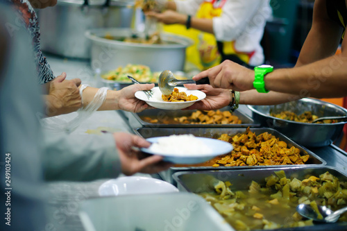 Free food distribution is social activity for helping the homeless people by giving them food.
