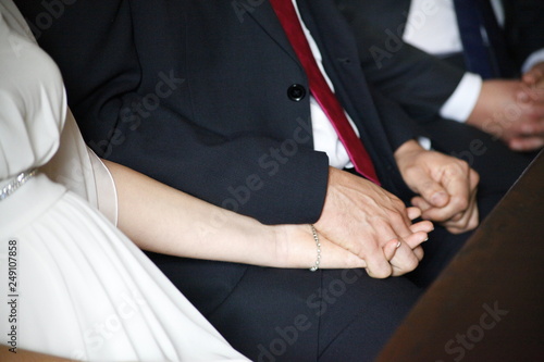 Bride and groom holding hands at the court house