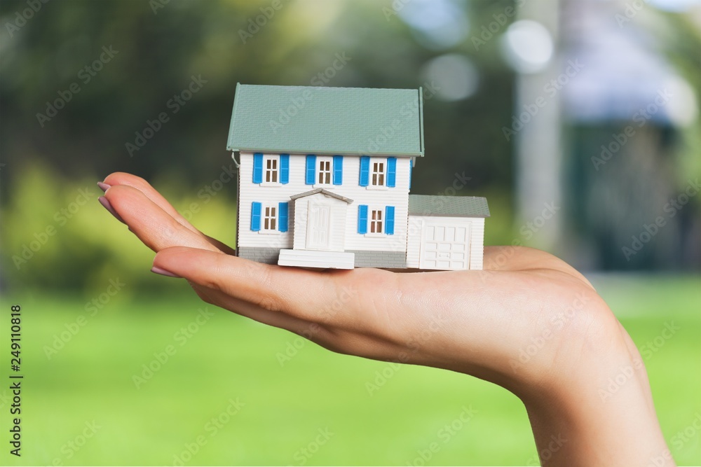 Businessman Holding House Model and Keys Stock Photo | Adobe Stock
