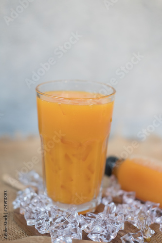 Freshly squeezed sweet orange juice with ice cubes