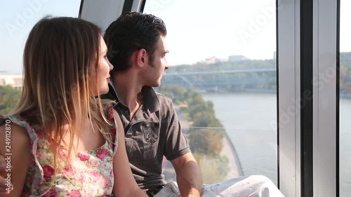 Couple having sightseeing tour on a cable car