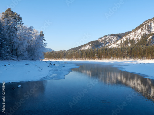 Blue Lake in the Mountain Valley of the Katun River, Chemale region. The Republic of the Mountain Altai. winter view of the lake in the mountains. fantastic nature.