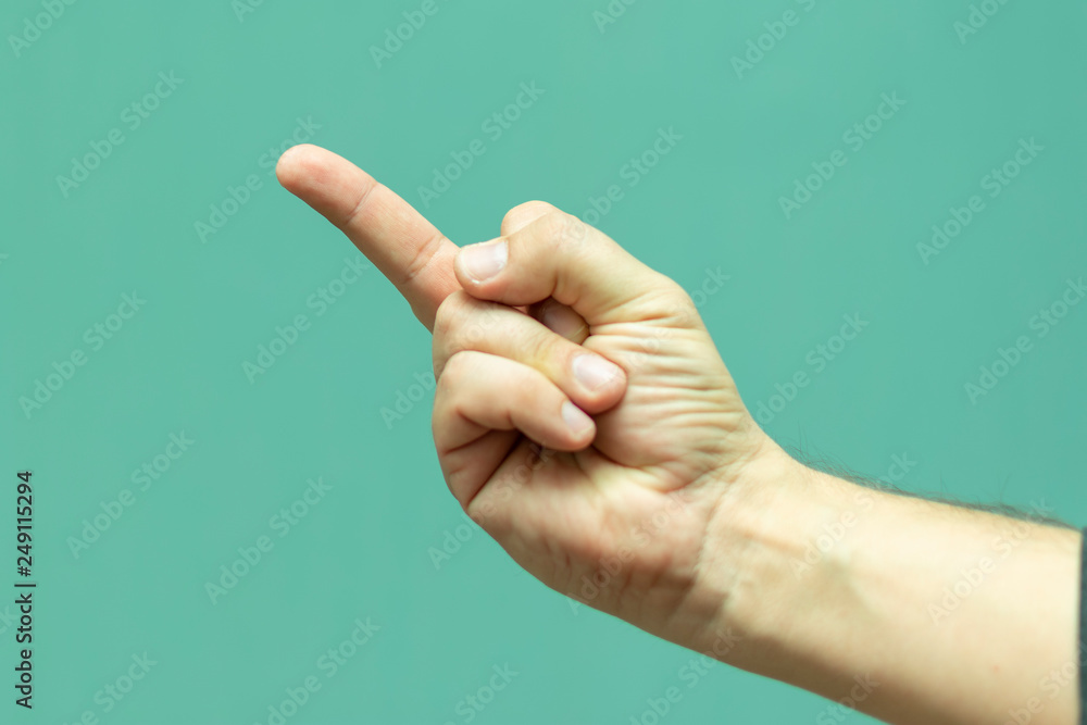 man shows hand gesture close up middle finger