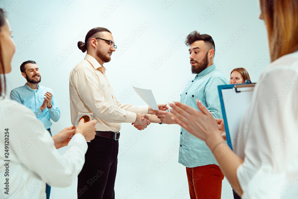 Boss approving and congratulating young successful employee of the company for his successes and good work. National Employee Appreciation Day, businesswoman, businessman, business, success, admire Boss approving and congratulating young successful employee of the company for his successes and good work. National Employee Appreciation Day, businesswoman, businessman, business, success, admire