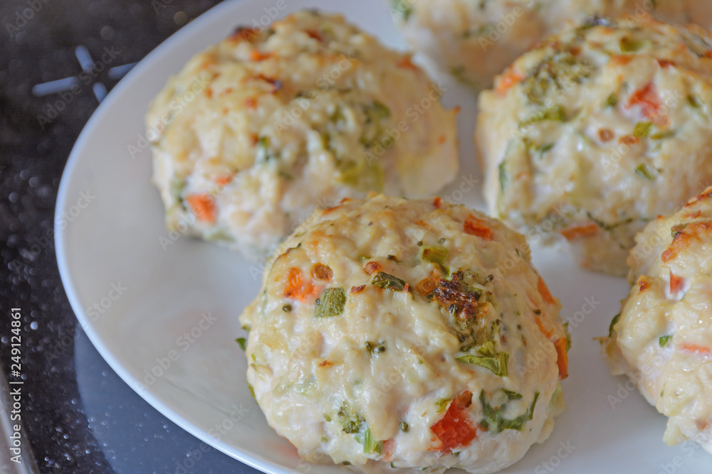 Chicken meatballs with vegetables - preparation for baked in the oven. Ingredients on the counter Healthy protein cutlets, minced cutlets. Proper, healthy food concept. Chicken meatballs with vegetables - preparation for baked in the oven. Ingredients on the counter Healthy protein cutlets, minced cutlets. Proper, healthy food concept.