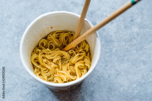 Instant Curry Flavored Ramen Noodles served with Chopsticks. in Plastic Cup