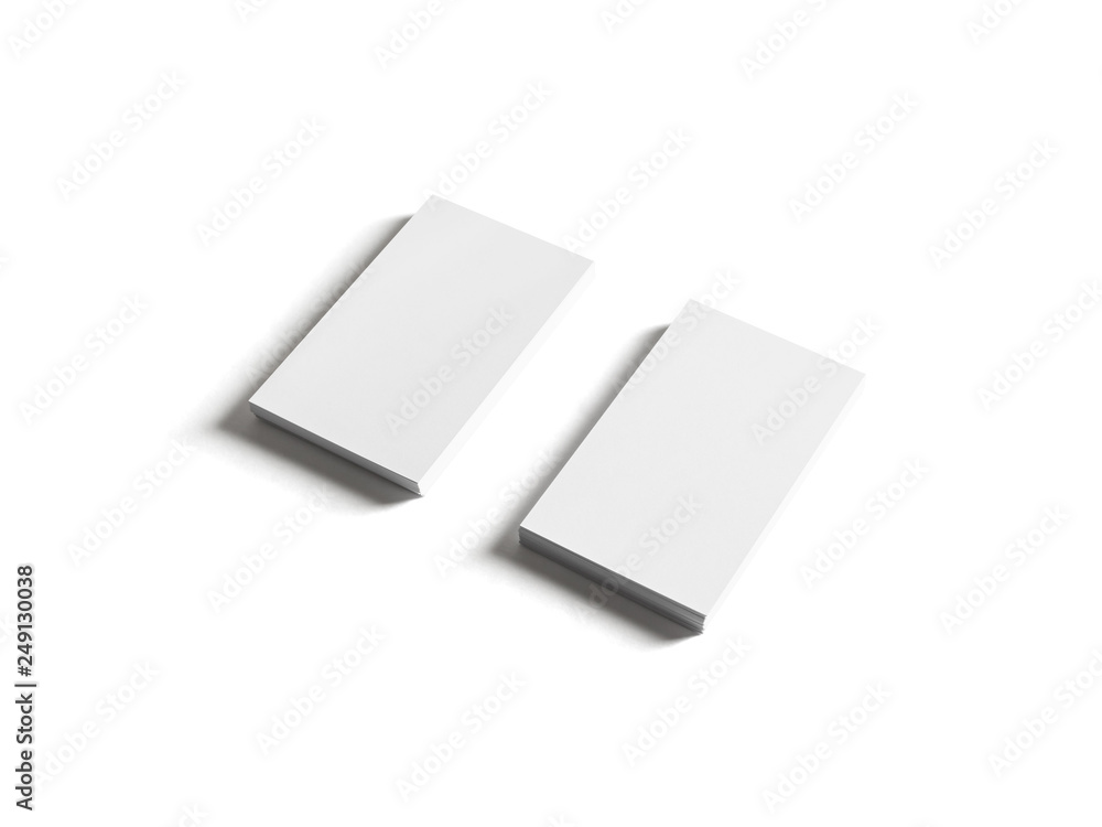 Two piles of blank business cards isolated on white background. Clipping path. Two piles of blank business cards isolated on white background. Clipping path.