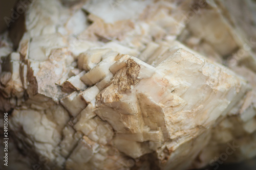 Calcite ore in the limestone quarry from mining and quarrying industries. Calcite is a carbonate mineral and the most stable polymorph of calcium carbonate (CaCO3).