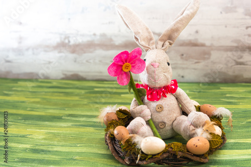 Easter rabbit and eggs with colorful eggs around and white background