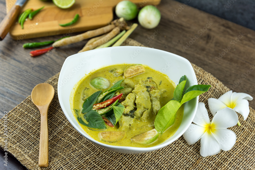 fish ball Green curry with coconut curry (Kaeng kheiyw hwan) on dark wooden background with Thai tradition food served with steamed rice. Thai food very popular fish ball Green curry with coconut curry (Kaeng kheiyw hwan) on dark wooden background with Thai tradition food served with steamed rice. Thai food very popular