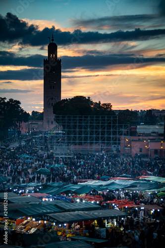 Mosque silhouetted at the main square in Marrakesh in Morocco photo