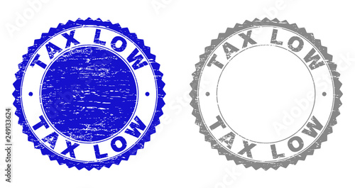 Grunge TAX LOW stamp seals isolated on a white background. Rosette seals with grunge texture in blue and gray colors. Vector rubber stamp imitation of TAX LOW text inside round rosette.