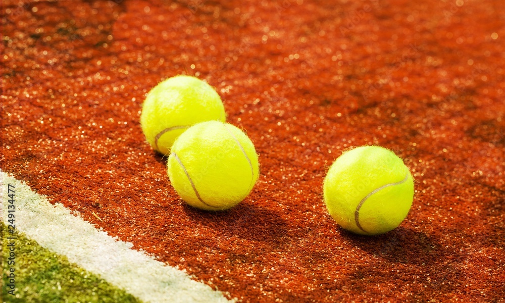 Tennis game. Tennis balls and rackets on  background.