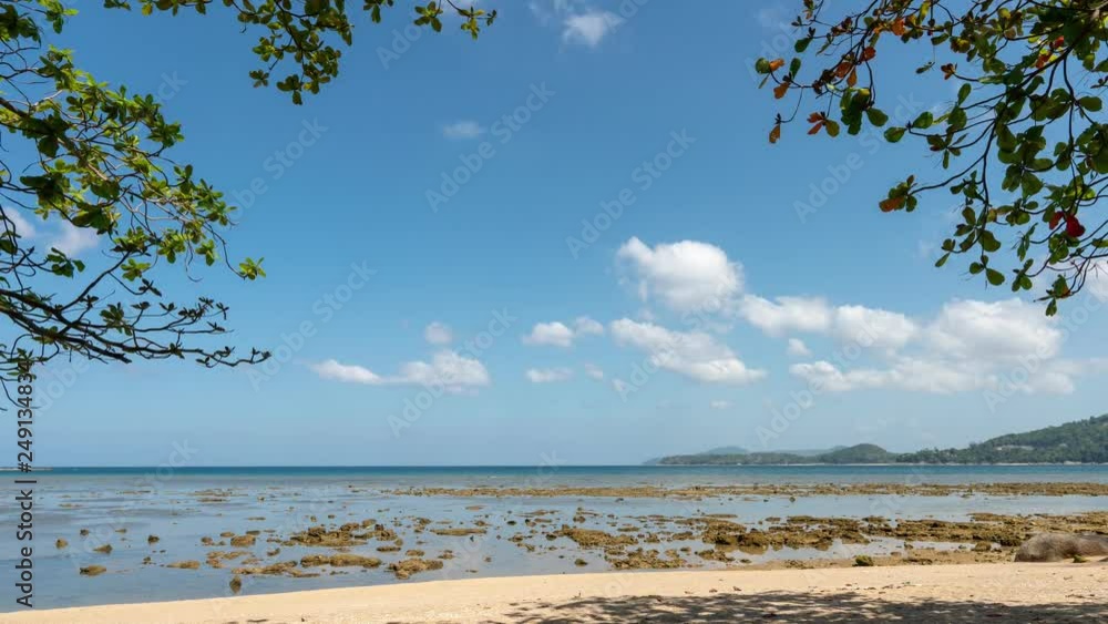 Time Lapse shot of exotic tropical beach with sand beach and tropical vegetation on the edge frame Beautiful white clouds moving fast in the sky Time Lapse shot of exotic tropical beach with sand beach and tropical vegetation on the edge frame Beautiful white clouds moving fast in the sky